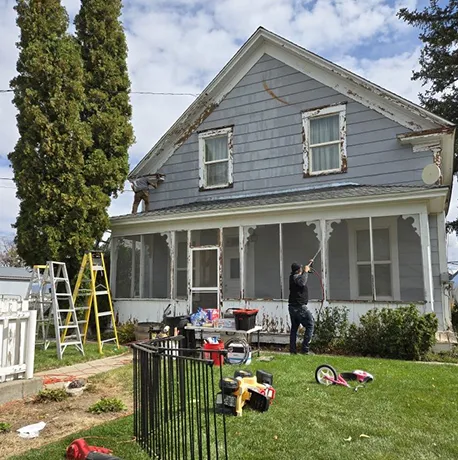 A well-maintained suburban home with a neatly cleaned exterior, demonstrating the benefits of roof and siding pressure washing.