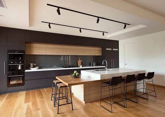 A modern kitchen with sleek cabinetry, pendant lighting, and a spacious island, showcasing expert kitchen remodeling in Carson City.