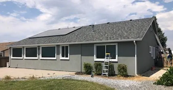 A newly renovated home exterior with fresh siding and roofing, showcasing professional home renovation services in Dayton, NV.